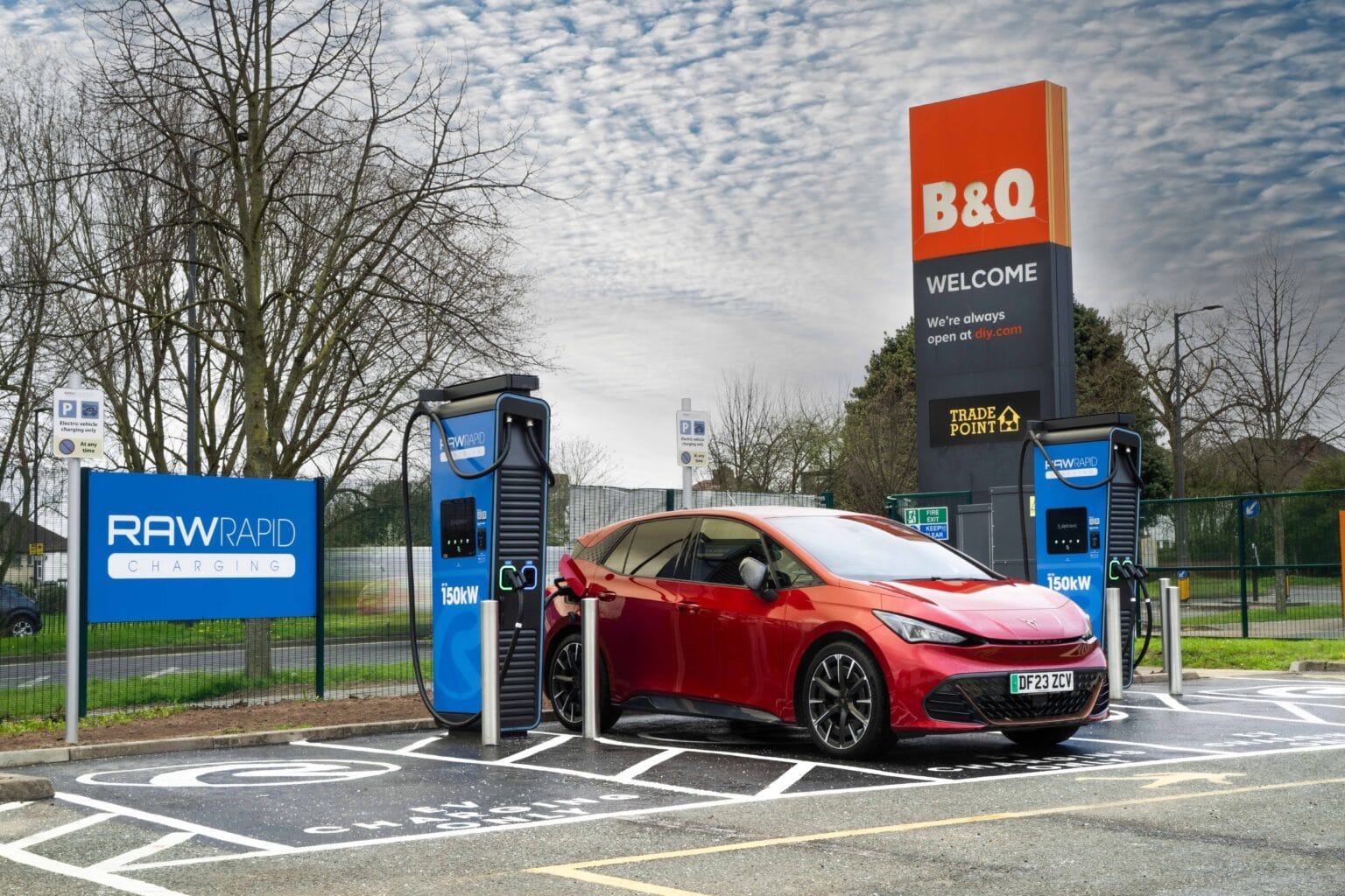 High-power rapid EV chargers with a vehicle charging at a retail site